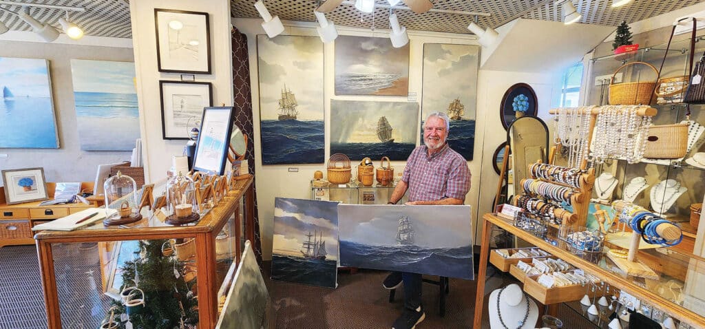 Greg Hill with paintings