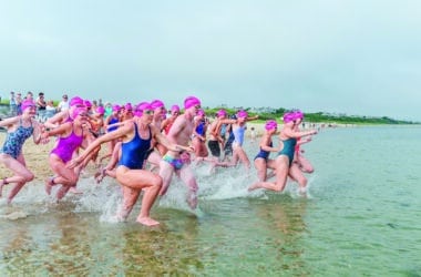 Swim Across America Nantucket swimmers running into ocean