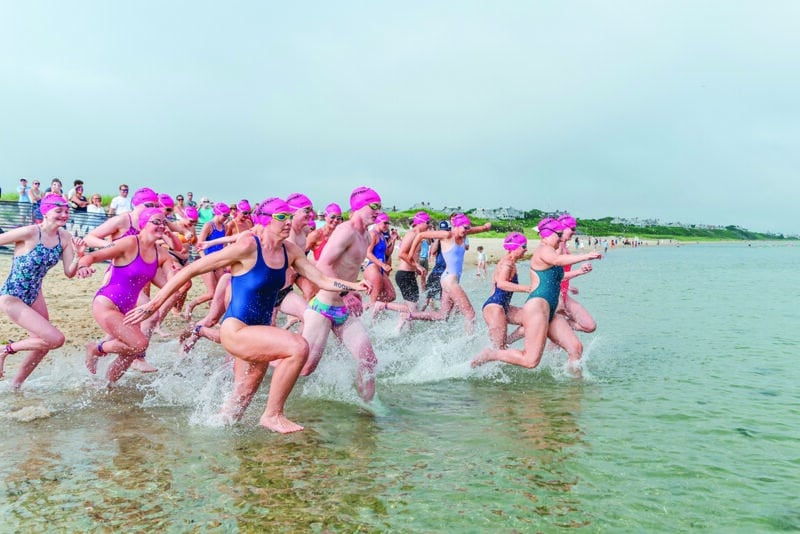 Swim Across America Nantucket swimmers running into ocean