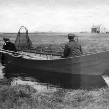 Men in a dory fishing for herring in Madaket (NHA, 1900s)