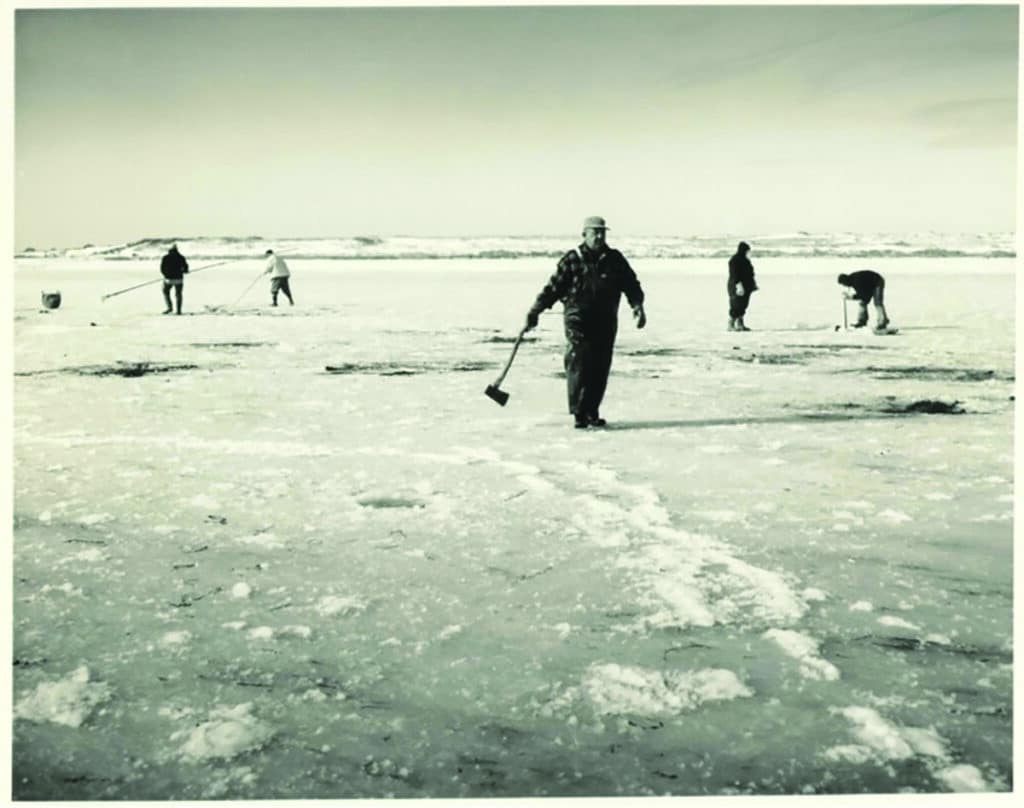 People fishing for eels through the ice on Hither Creek in Madaket. (NHA, 1961)