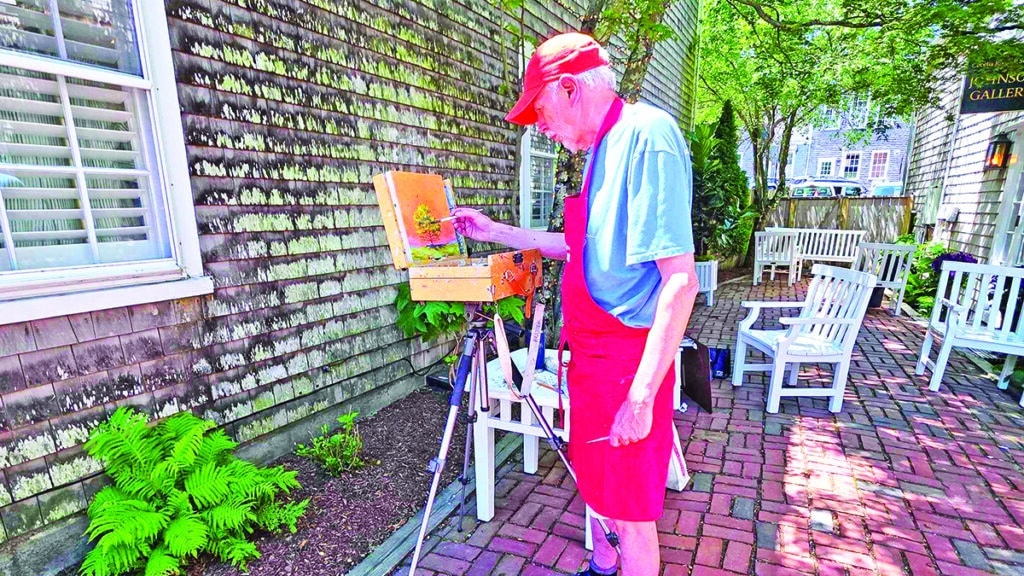 Artist displaying original artwork during an Artists Association of Nantucket Patio Pop-Up