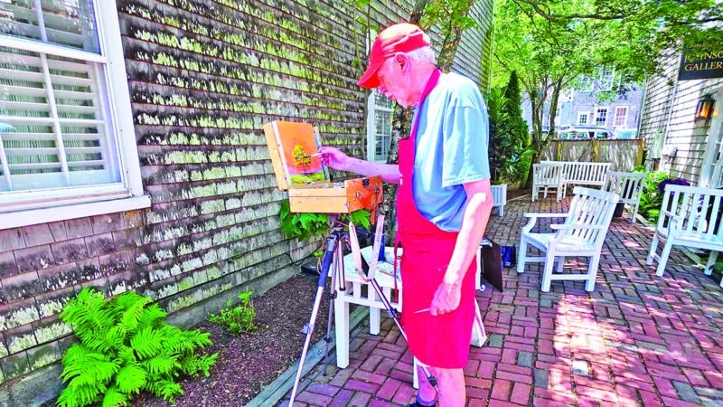 Artist displaying original artwork during an Artists Association of Nantucket Patio Pop-Up