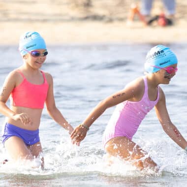 Swimmers at Jetties Beach participate in the Swim Across America Nantucket charity open water swim raising funds for cancer care and research.