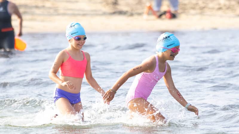 Swimmers at Jetties Beach participate in the Swim Across America Nantucket charity open water swim raising funds for cancer care and research.