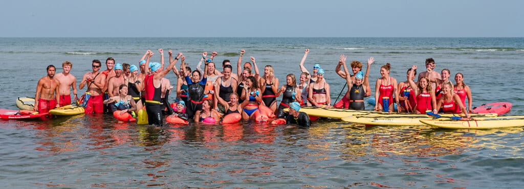 Lifeguards at Jetties Beach participate in the Swim Across America Nantucket charity open water swim raising funds for cancer care and research.